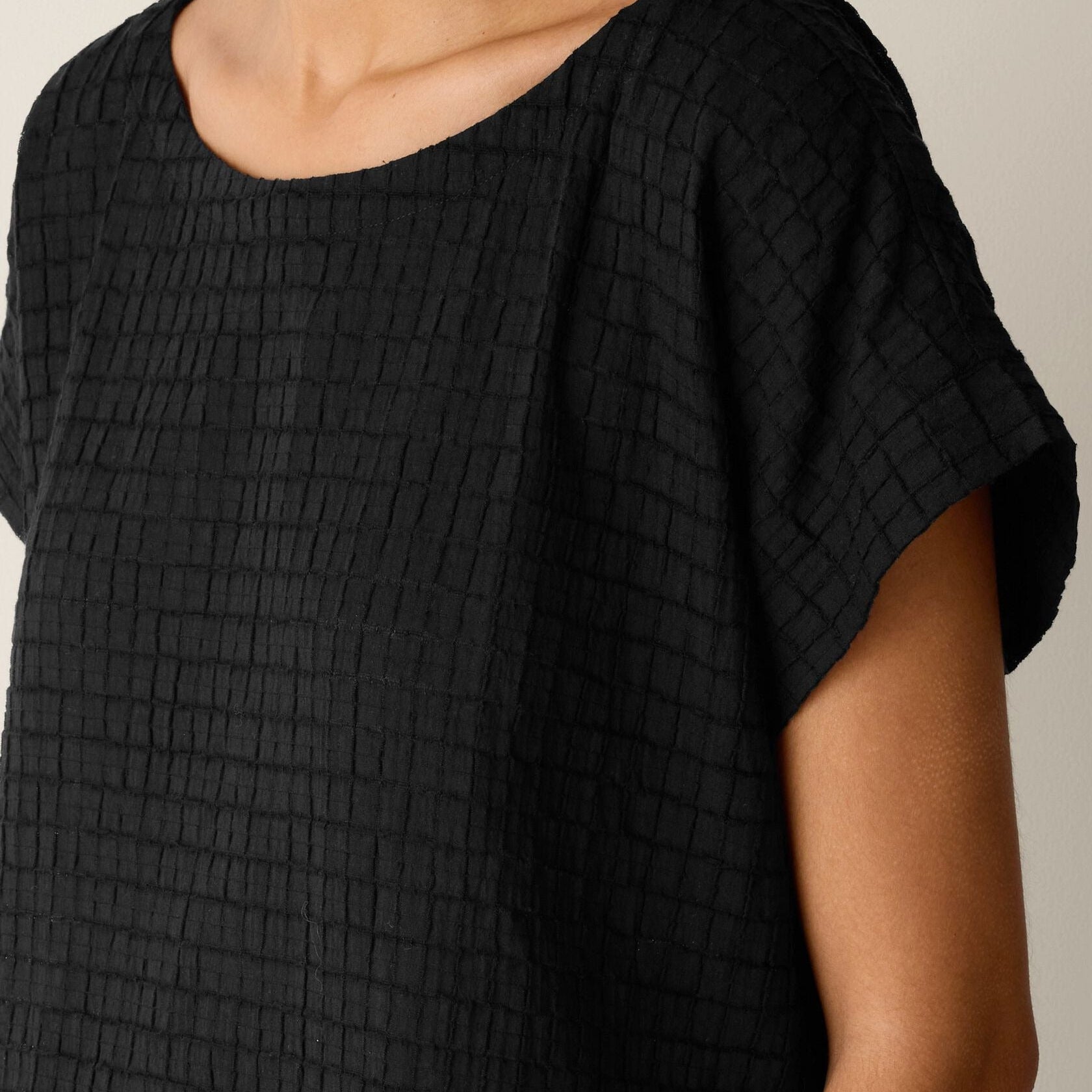 Women's black relaxed fit short sleeve top