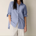 Women's blue long sleeve collared shirt